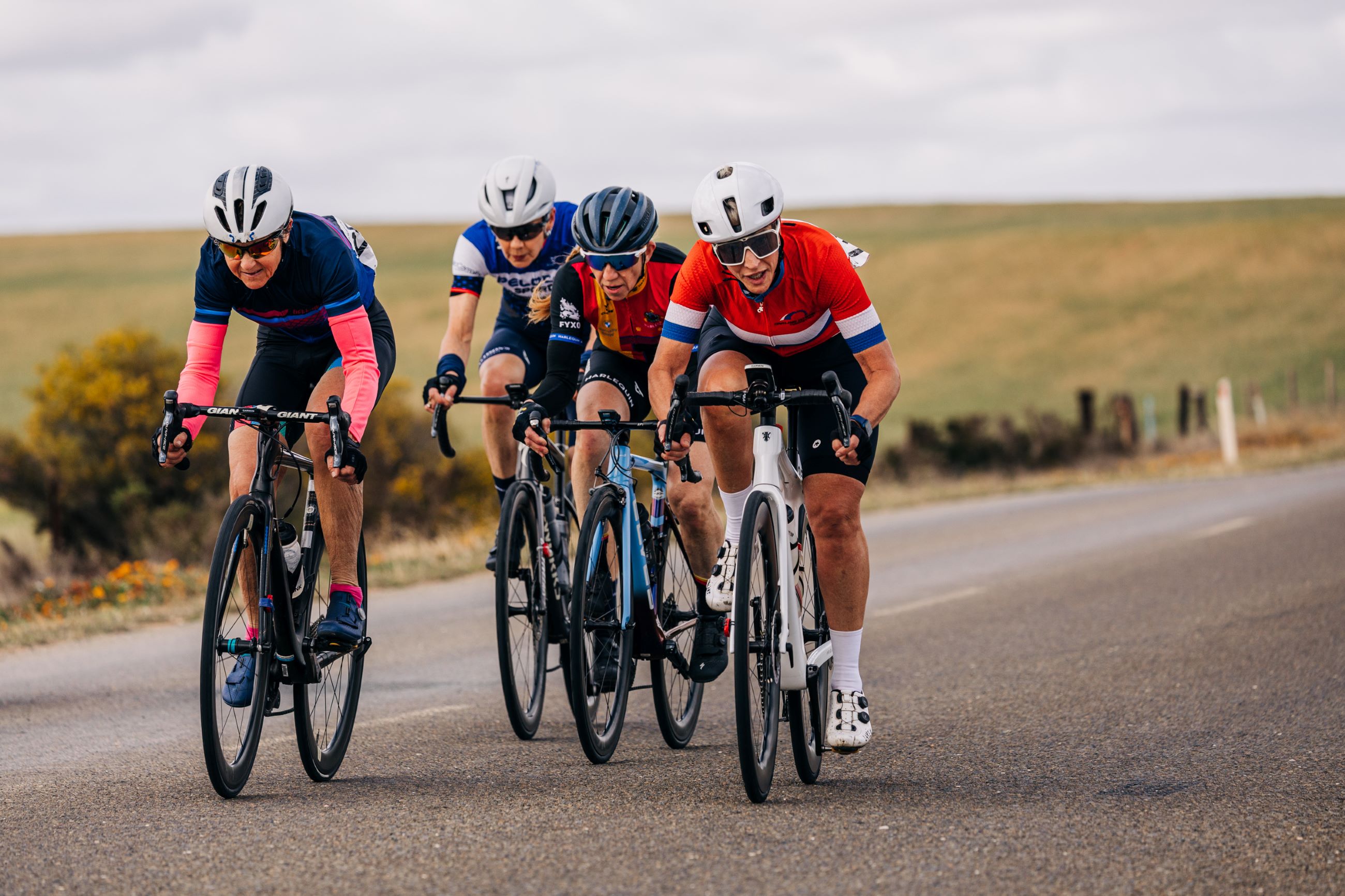 Four masters women riders on the open road during the road race at the 2024 AusCycling Masters & Junior Road National Championships in Loxton